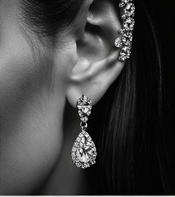 Dangling diamond earrings on velvet